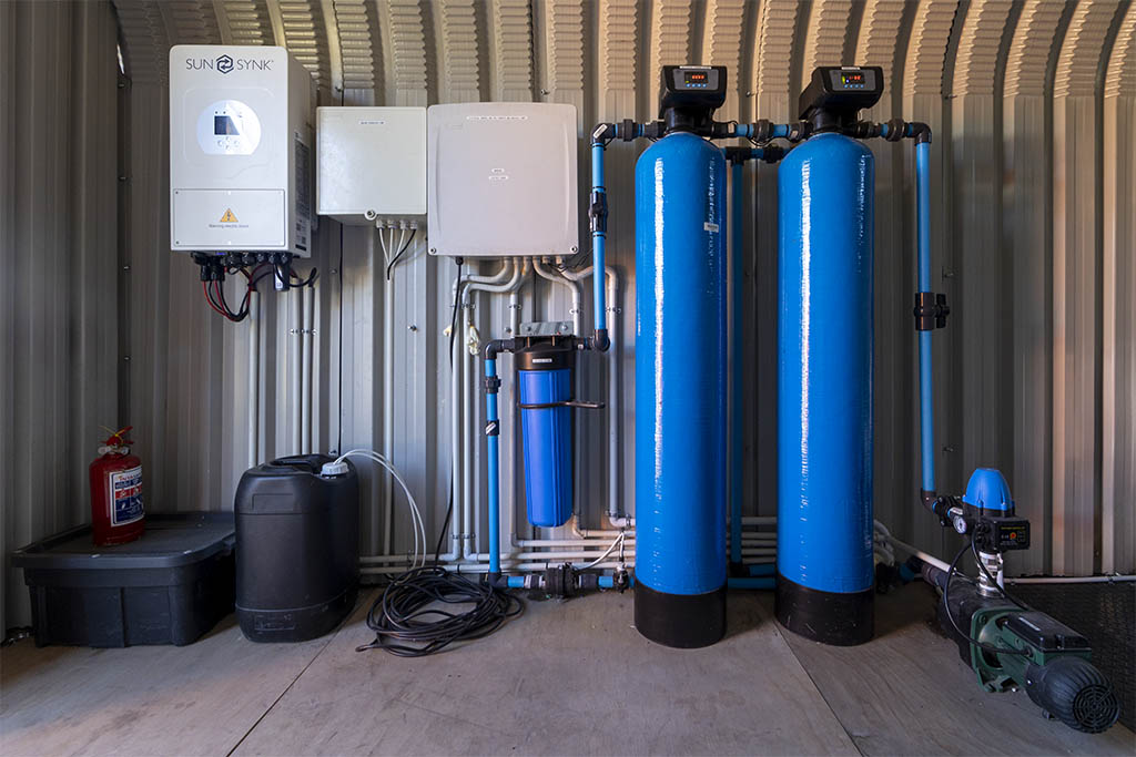 Solar powered water treatment system with inverter and FRP vessels with chemical dosing